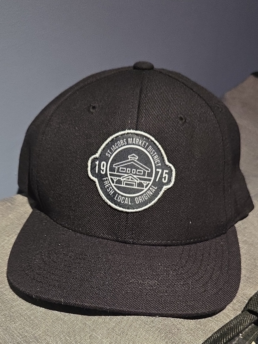 St. Jacob's Market District Black Hat with Gold Logo Label